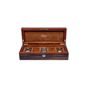 A handcrafted, solid wood Macassar finished watch box with space for five watches, featuring a suede interior and a lock.
