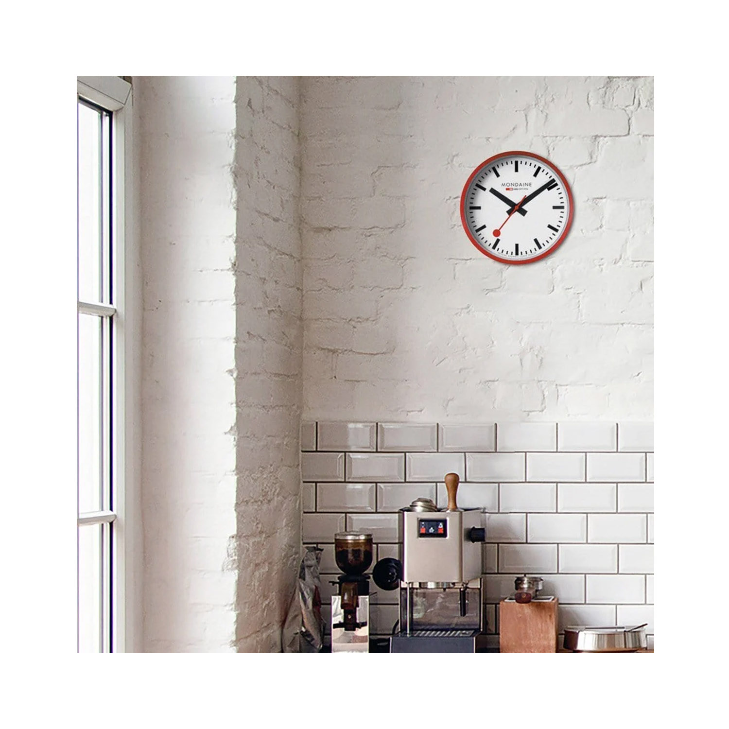 Mondaine, Red Wall Clock with a 25cm diameter aluminium case with a quartz battery featuring a three hand white face.