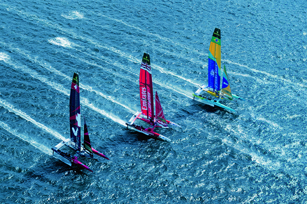 Three sail boats on water