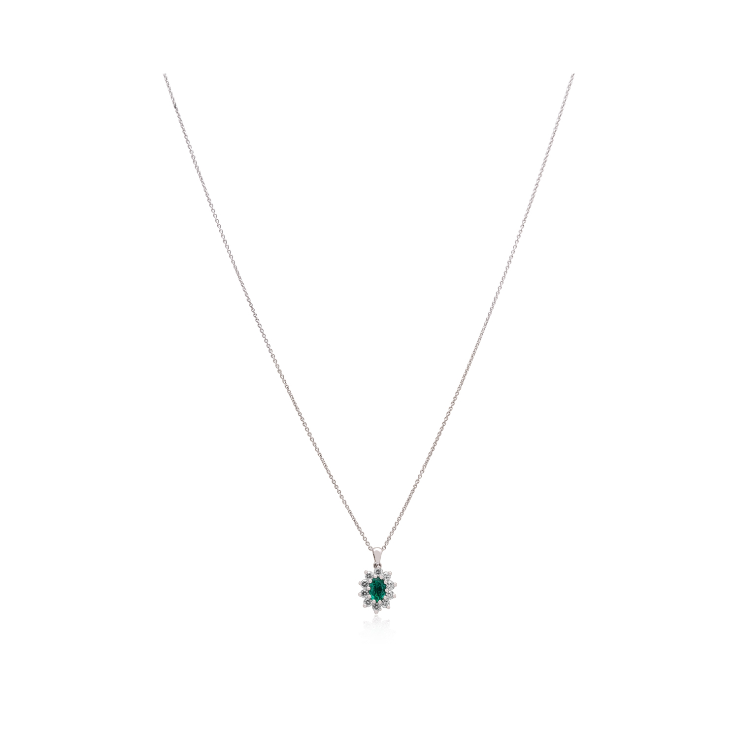 An 18ct white gold oval shaped emerald and diamond set cluster pendant and chain.