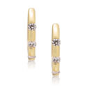 A pair of 18ct yellow gold three stone round brilliant cut diamond hoop earrings, for pierced ears.