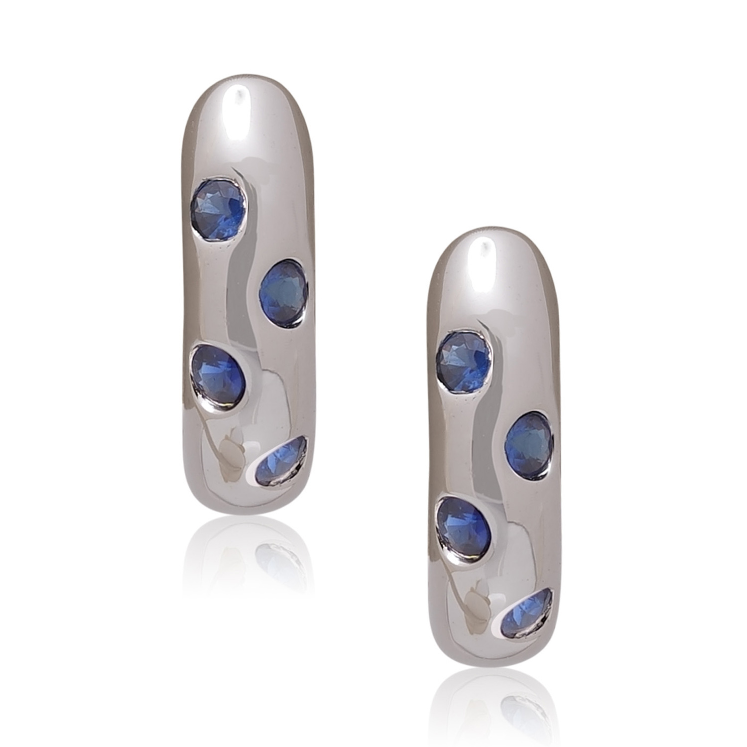 A pair of 18ct white gold hoop style earrings set with four sapphires on each earring, for pierced ears.