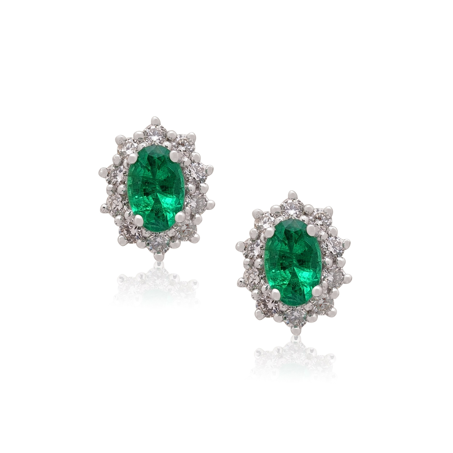 A pair of 18ct white gold oval emerald and diamond set cluster stud earrings, for pierced ears.