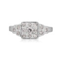 An Art Deco square diamond set cluster ring with Odeon style diamond shoulders in 14ct white gold.