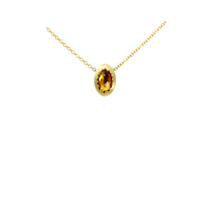 A 9ct yellow gold citrine rubover set pendant and chain.