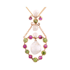 An antique pendant set with three pearls, six peridots and eight rubies.