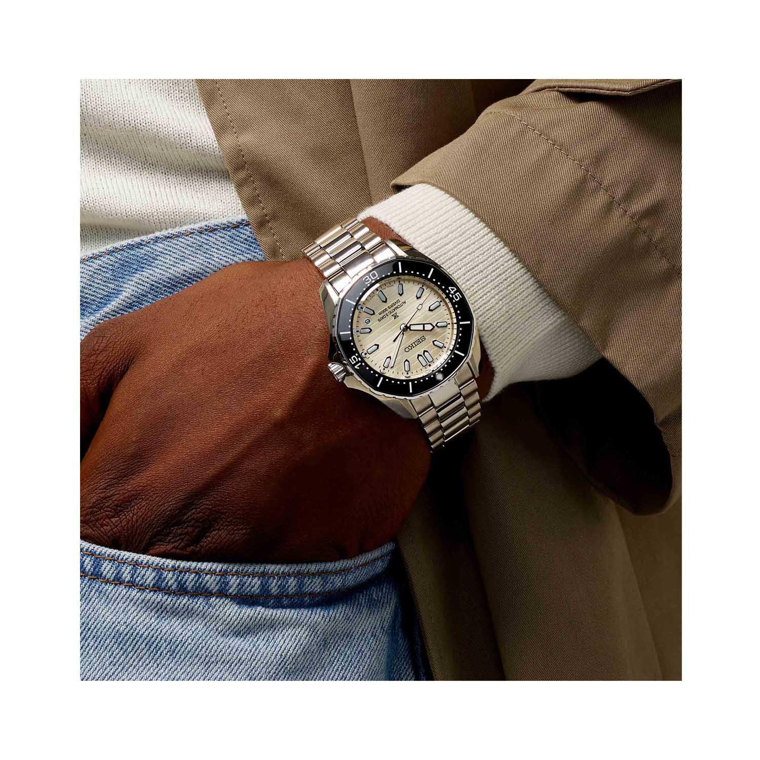 Seiko, Prospex 'Polygonal In Pearl White' with a 41.3mm stainless steel case and bracelet strap featuring a date function, a pearl white dial and a black bezel.