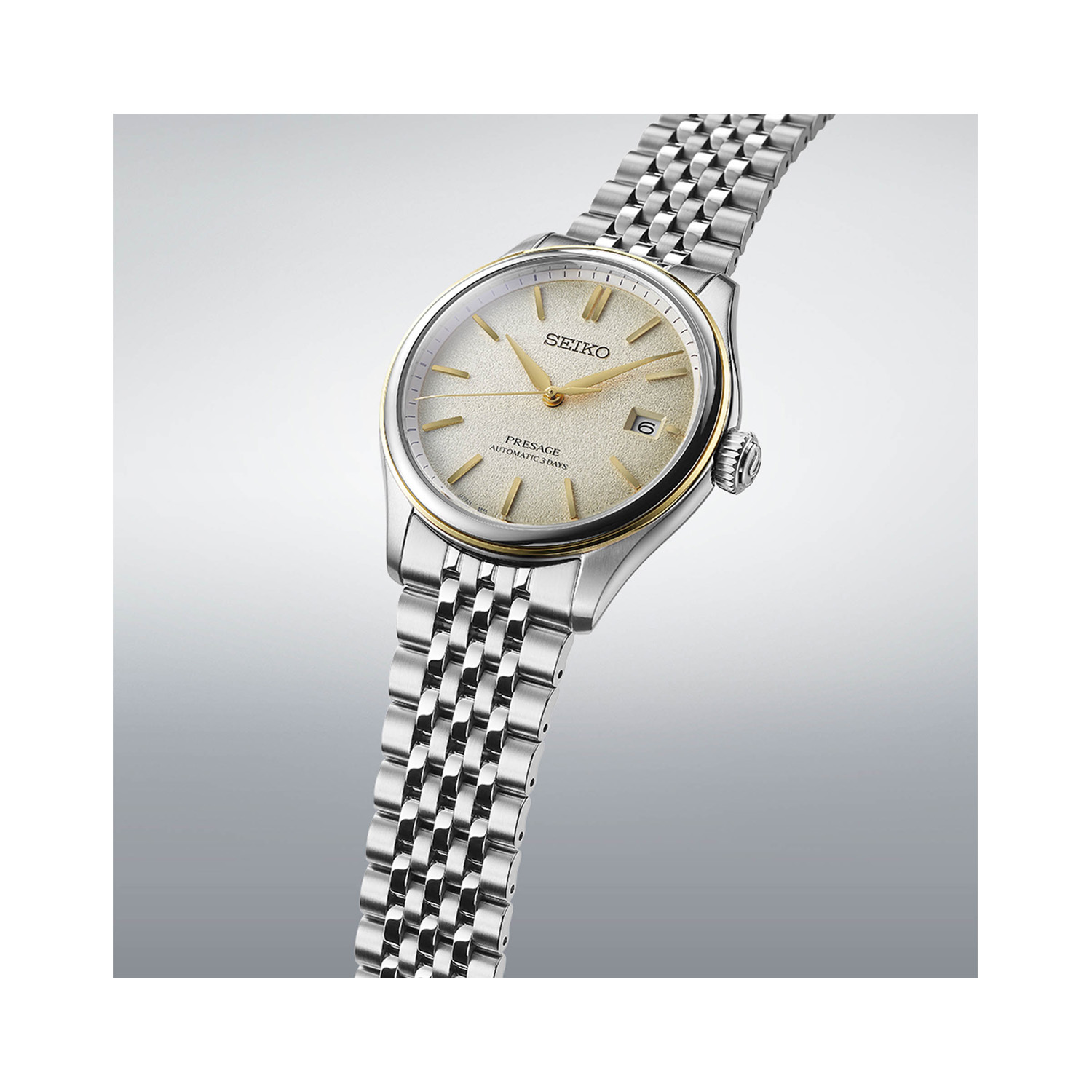 Seiko, Presage Classic Series in Delicate Cream Silk, Automatic Men's Watch Seiko, Presage Classic Series in Delicate Cream Silk with a 40.2mm stainless steel case and bracelet strap featuring a date function and a champagne coloured dial.