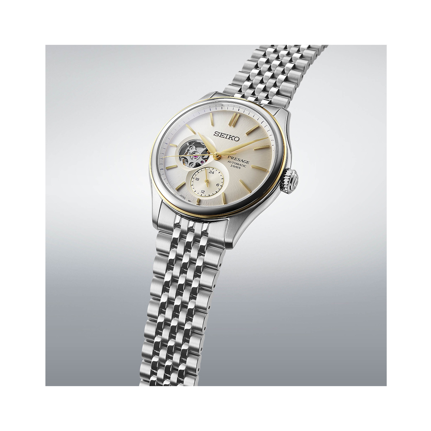 Seiko, Presage Classic Series 'Open Heart in Delicate Cream Silk' with a 40.2mm stainless steel case and bracelet strap featuring an open heart champagne coloured dial and a stop seconds function.