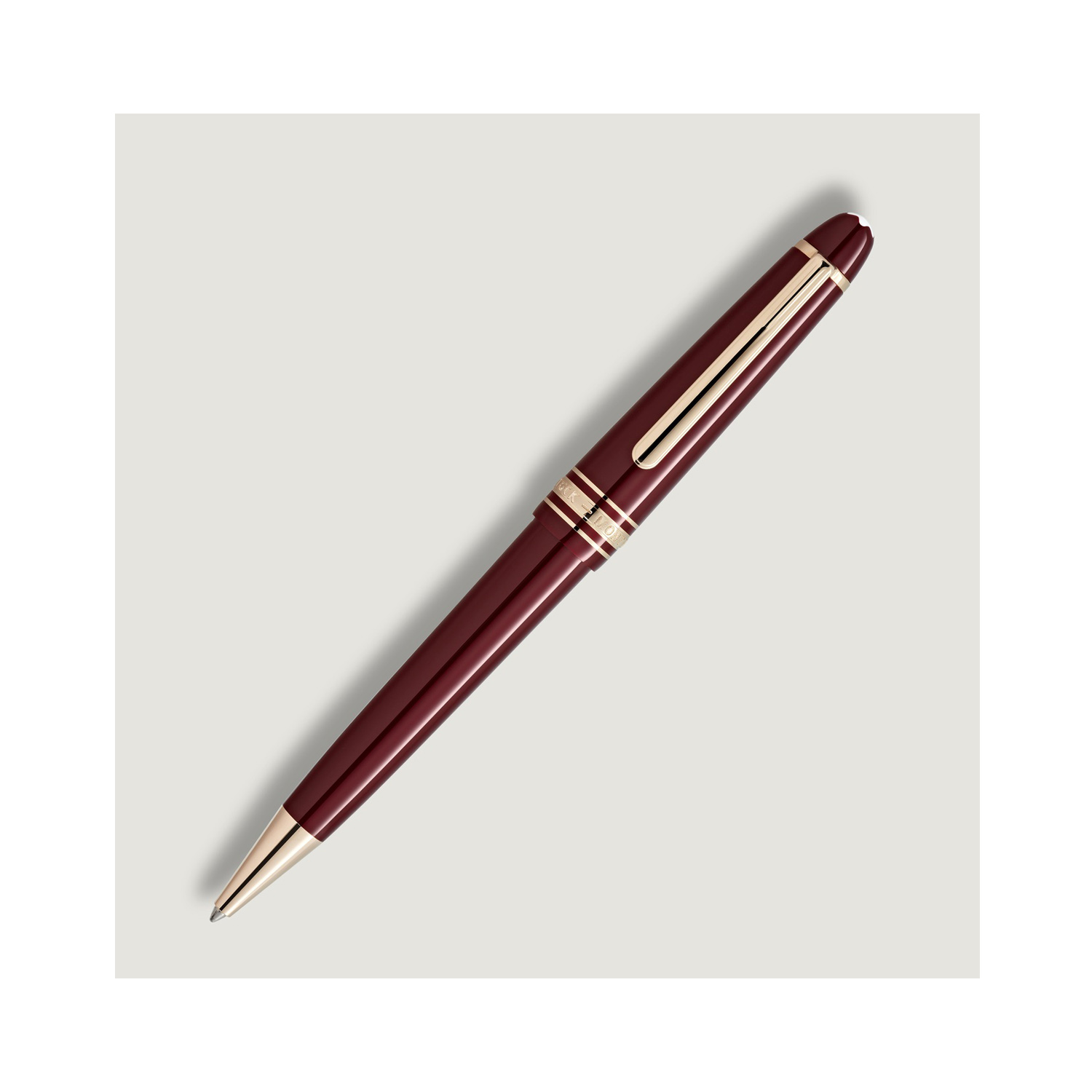 Montblanc, Meisterstück Burgundy Red Midsize Ballpoint Pen A Montblanc, Meisterstück Burgundy Red midsize ballpoint pen crafted in precious resin with signature gold fittings, featuring the iconic white Montblanc emblem inlaid in the cap top.