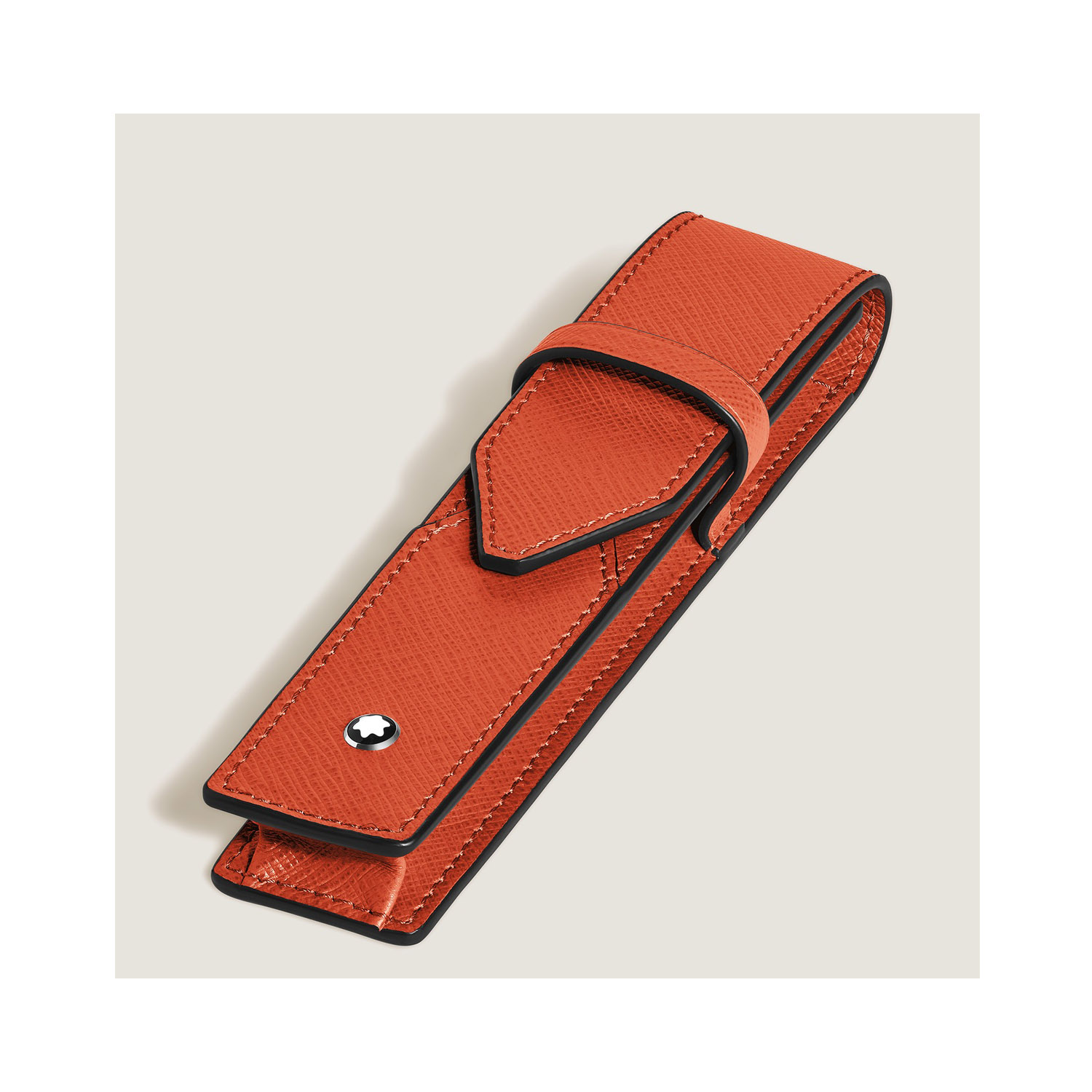 A Montblanc, Envelope tangerine pen pouch crafted in embossed sartorial leather with space to hold one writing instrument with a folding closure.