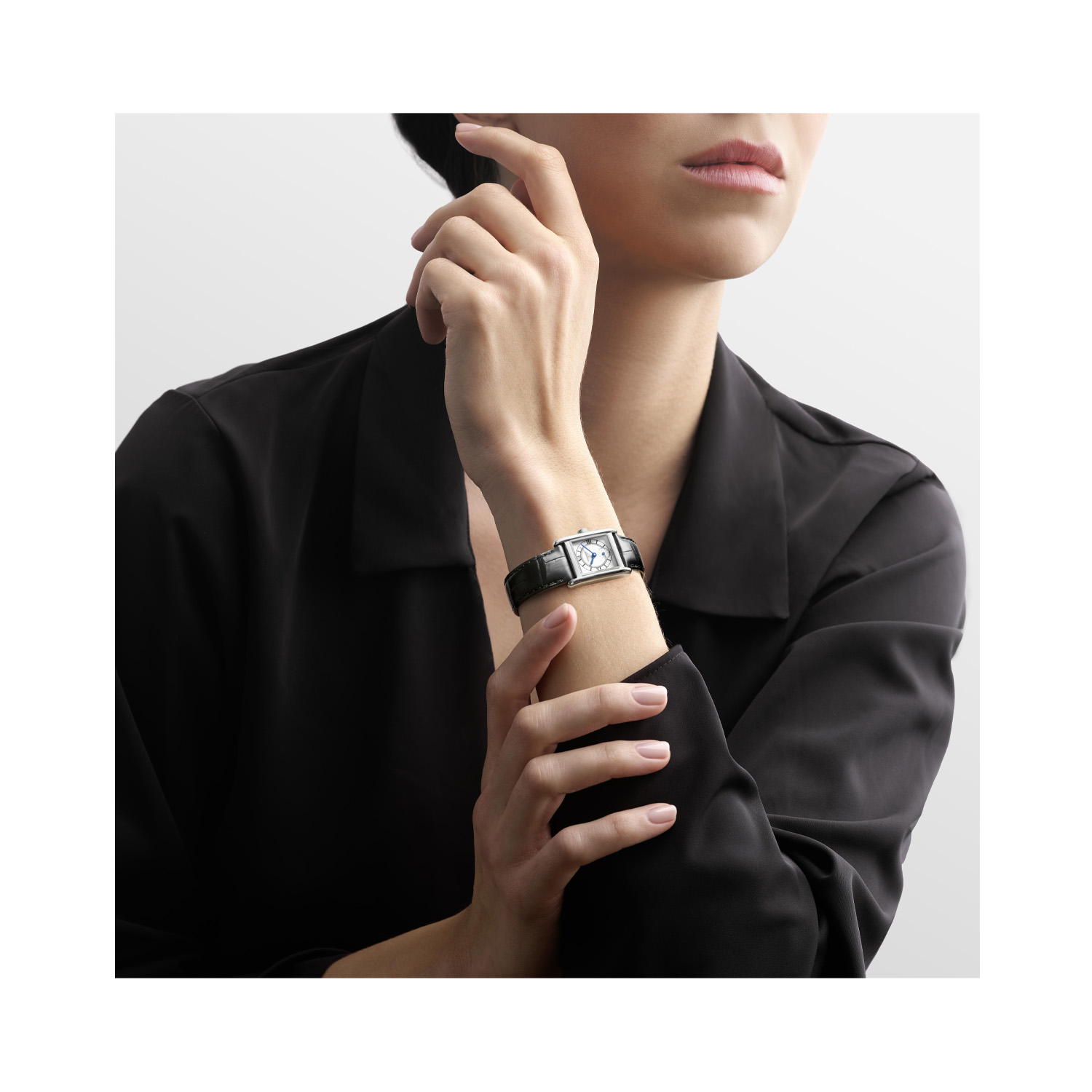 Longines, Mini DolceVita with a 21.5 x 29mm stainless steel case and black leather strap featuring a small seconds hand and a silver dial.