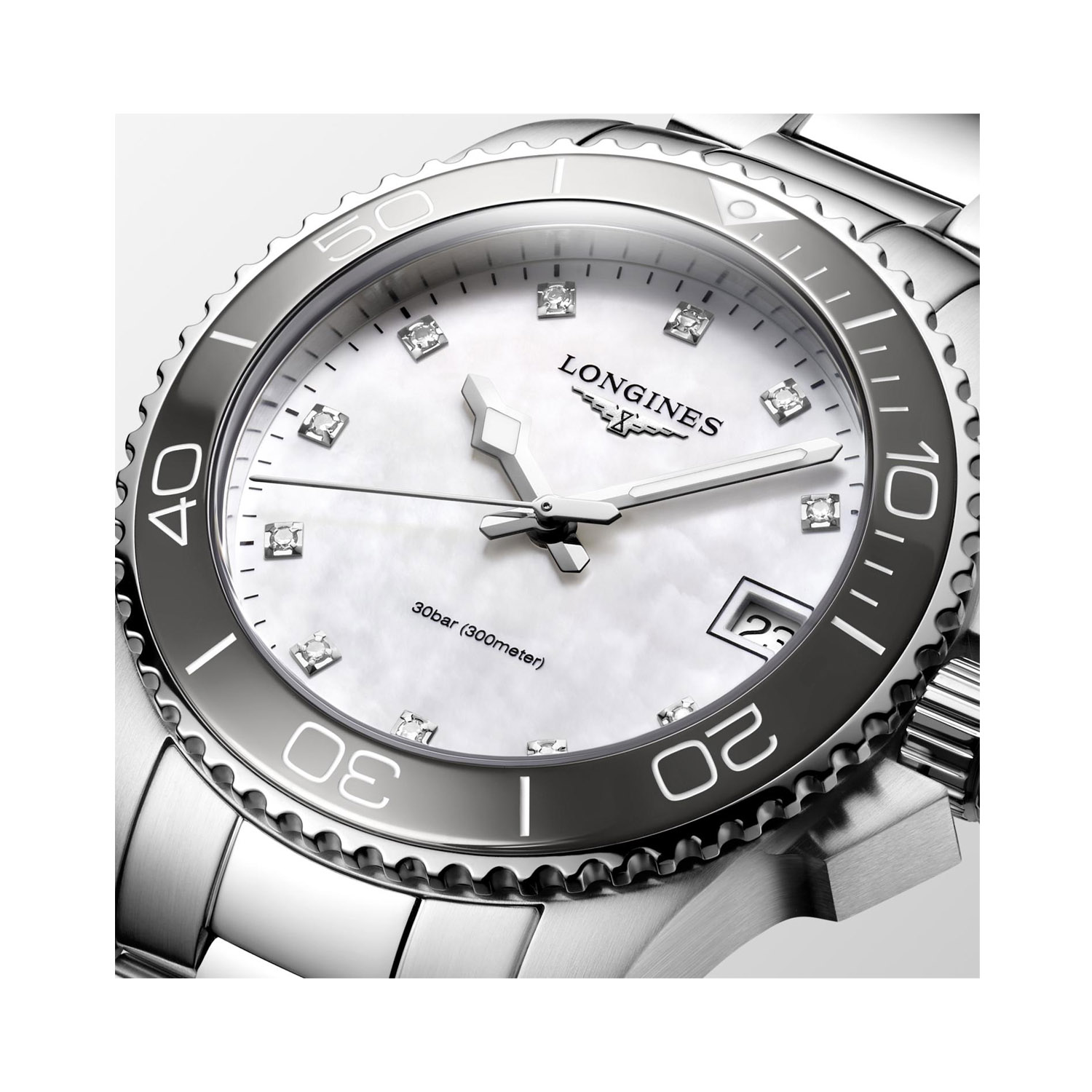 Longines, HydroConquest with a 32mm stainless steel case and bracelet strap featuring a date function and a white mother of pearl, diamond set dial with a grey ceramic bezel.