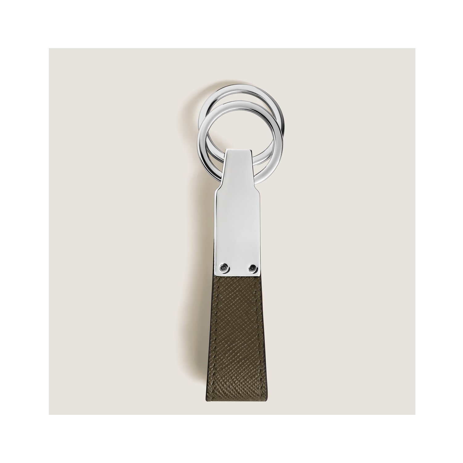Montblanc, Sartorial Khaki Loop Key Holder A Montblanc, Sartorial loop key holder crafted in khaki Saffiano-printed leather and shaped into a loop, featuring increased functionality with the detachable ring to loop in several keys.