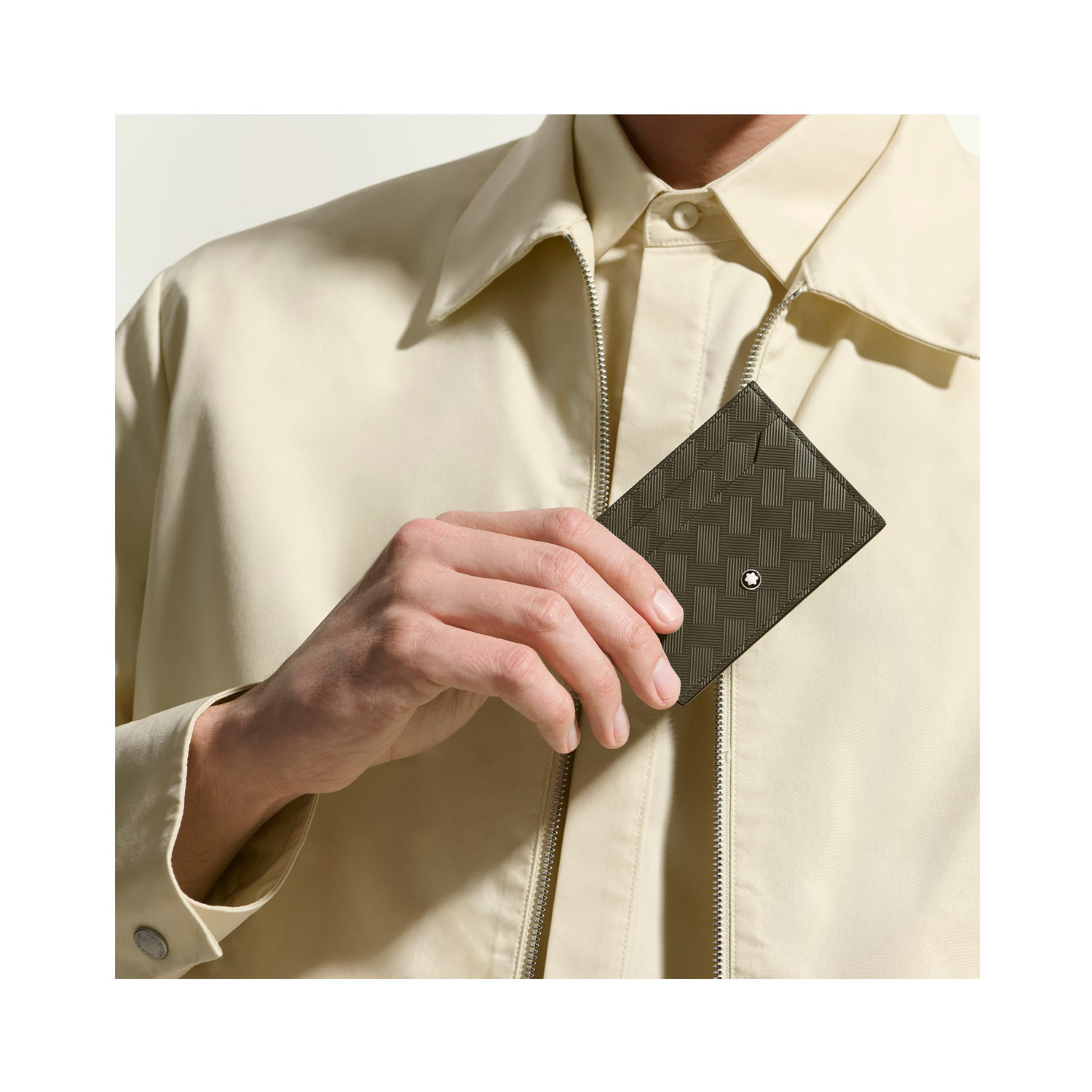 A Montblanc, Extreme 3.0 card holder crafted in embossed khaki coloured leather with the distinctive Extreme 3.0 motif, featuring space for up to five credit cards and finished with the Montblanc emblem on the front.