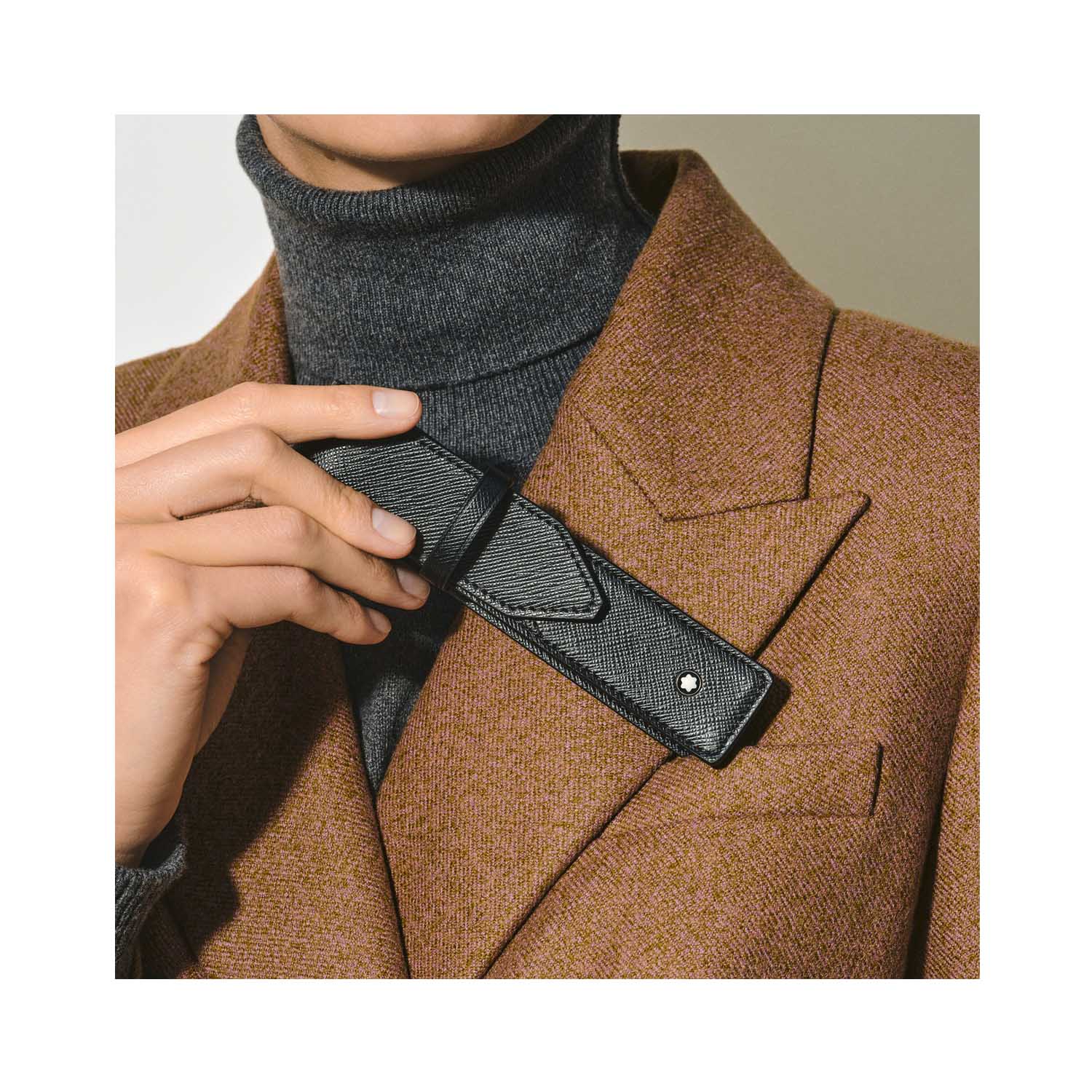 A Montblanc, Sartorial pen pouch crafted in black full grain leather with an envelope closure, made to hold one writing instrument.