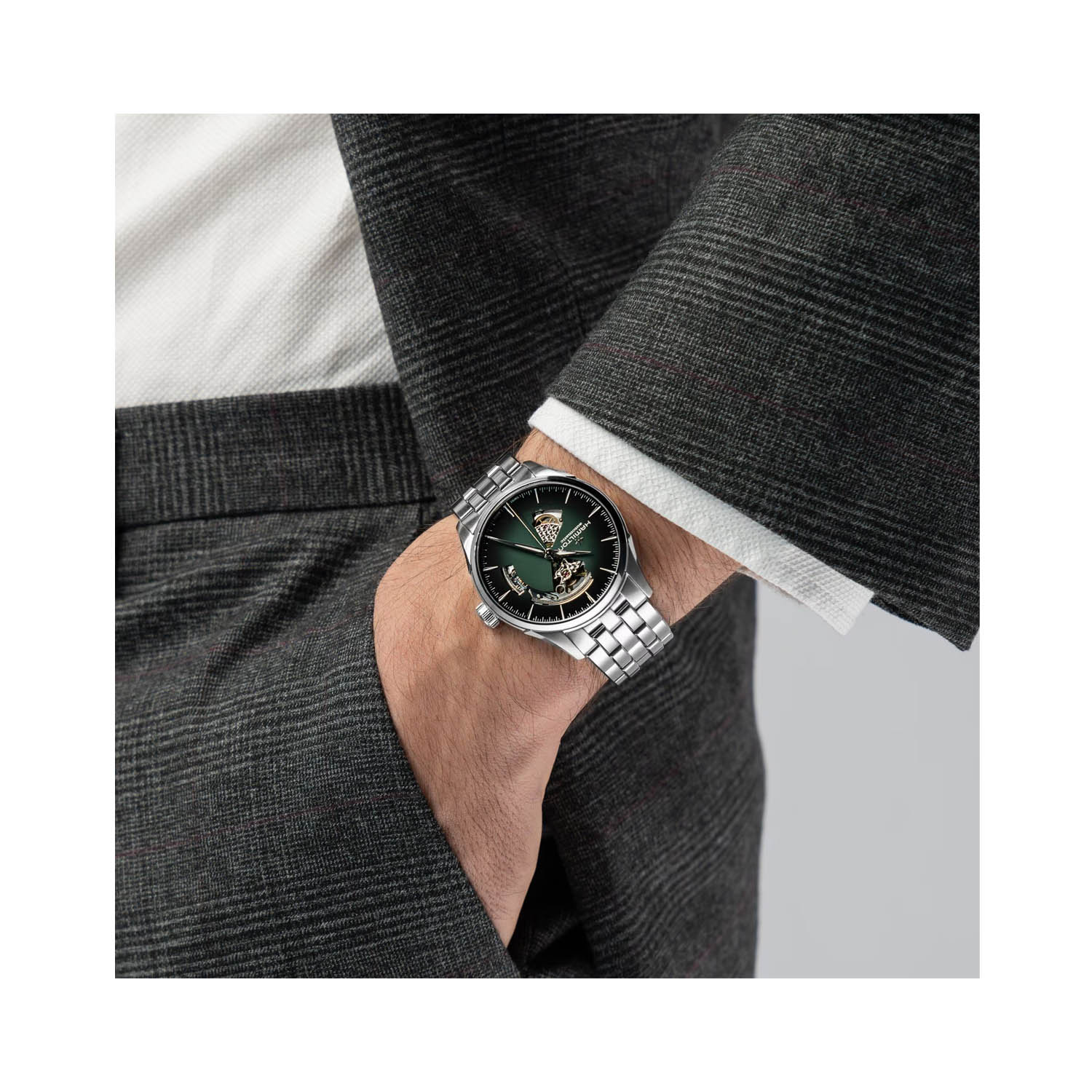 Hamilton, Jazzmaster Open Heart with a 42mm stainless steel case and bracelet strap featuring a green open heart dial.