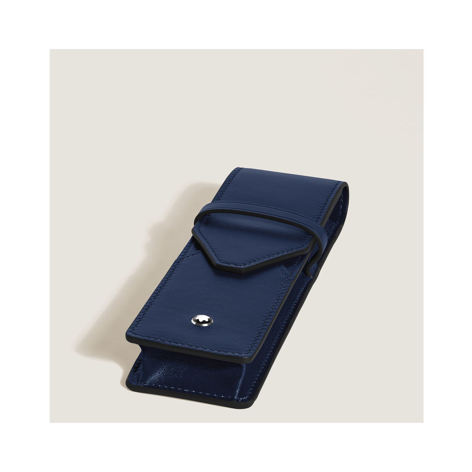 A Montblanc, Envelope pen pouch crafted in smooth ink blue leather with space for two writing instruments and finished with the Montblanc emblem.