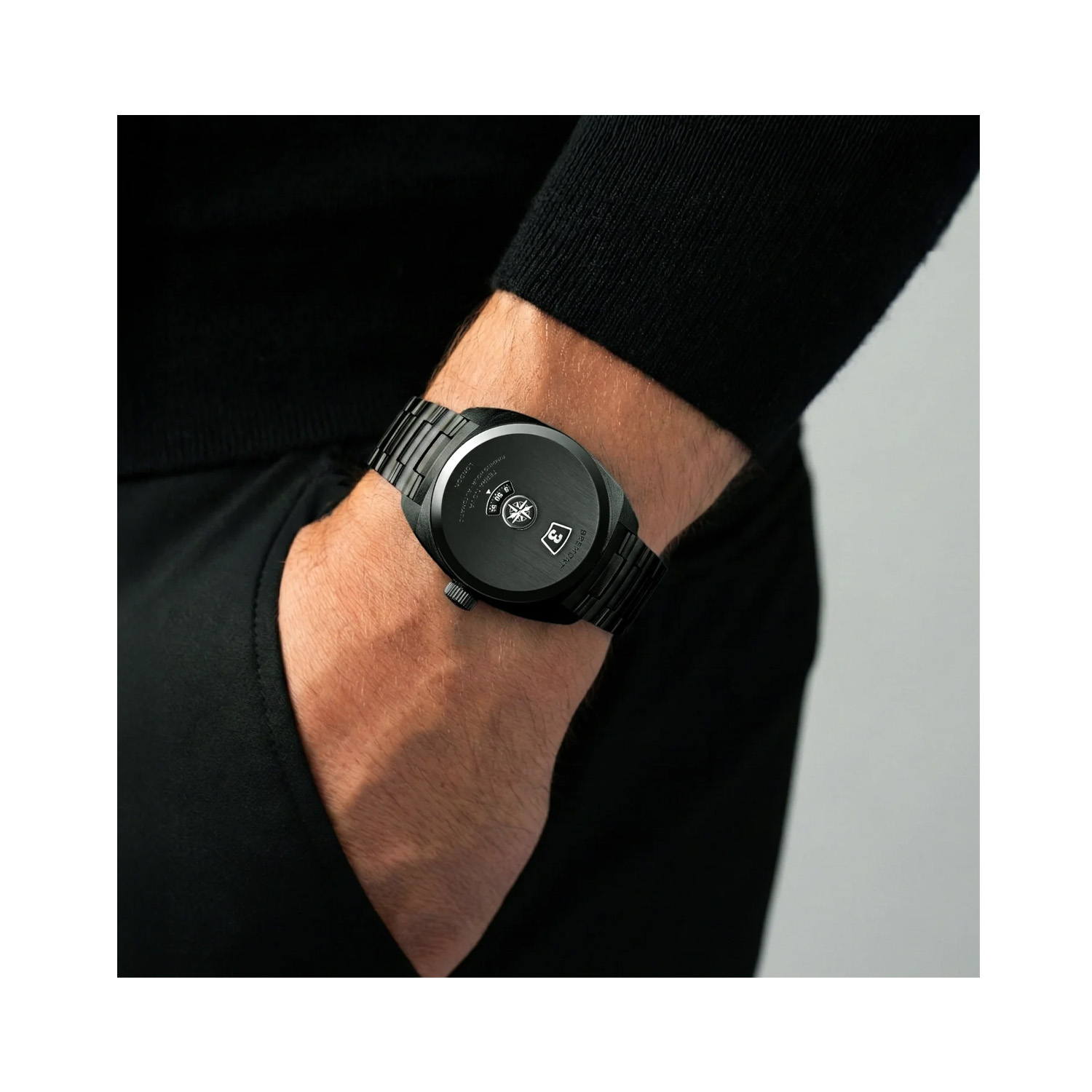 Bremont, Terra Nova 38 Jumping House Stealth Black with a black DLC coated 38mm stainless steel case and bracelet strap featuring a three window black dial.