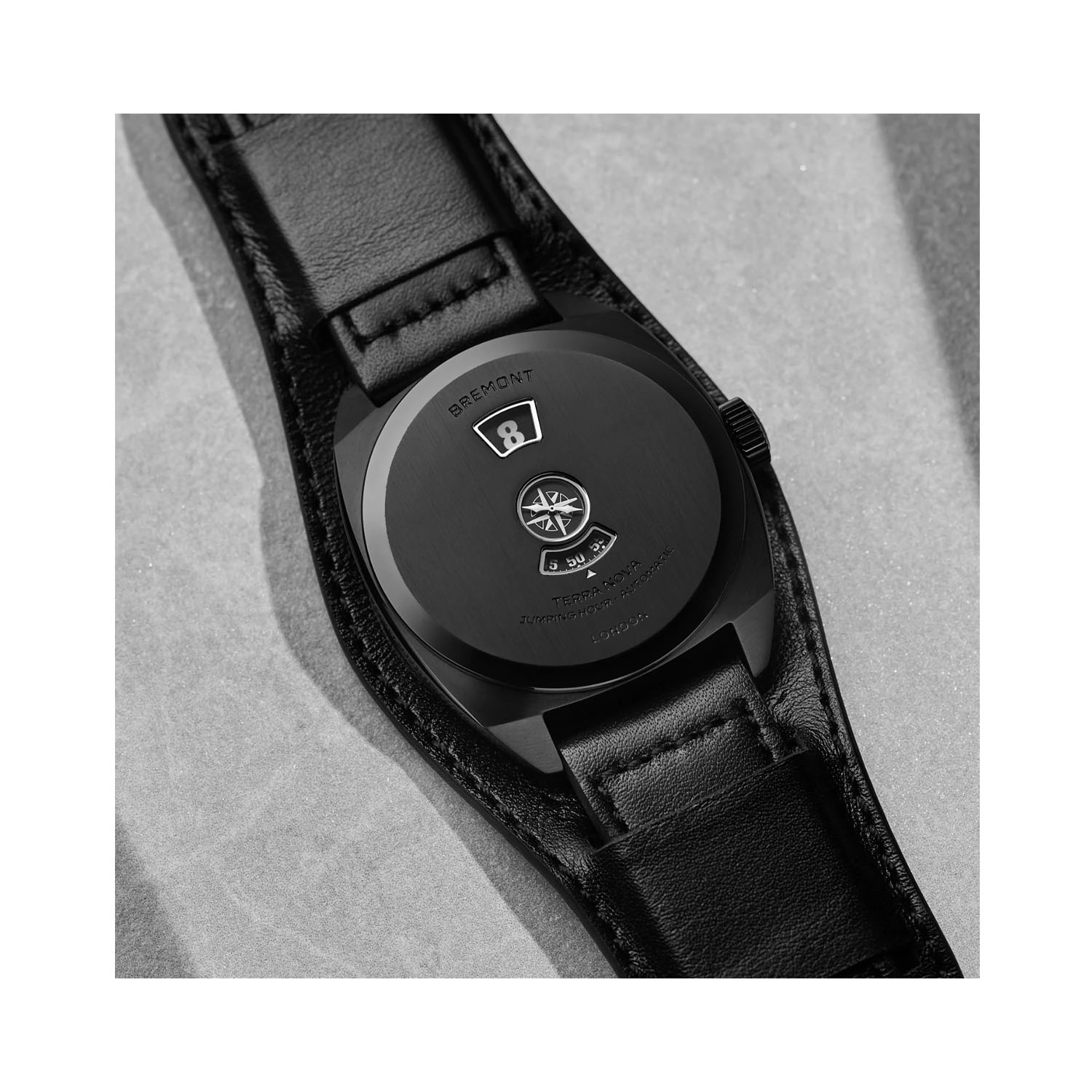 Bremont, Terra Nova 38 Jumping Hour Stealth Black Leather Strap, Automatic Men's Watch Bremont, Terra Nova 38 Jumping Hour Stealth Black with a 38mm black DLC coated stainless steel case and a leather bund strap featuring a three window black dial.