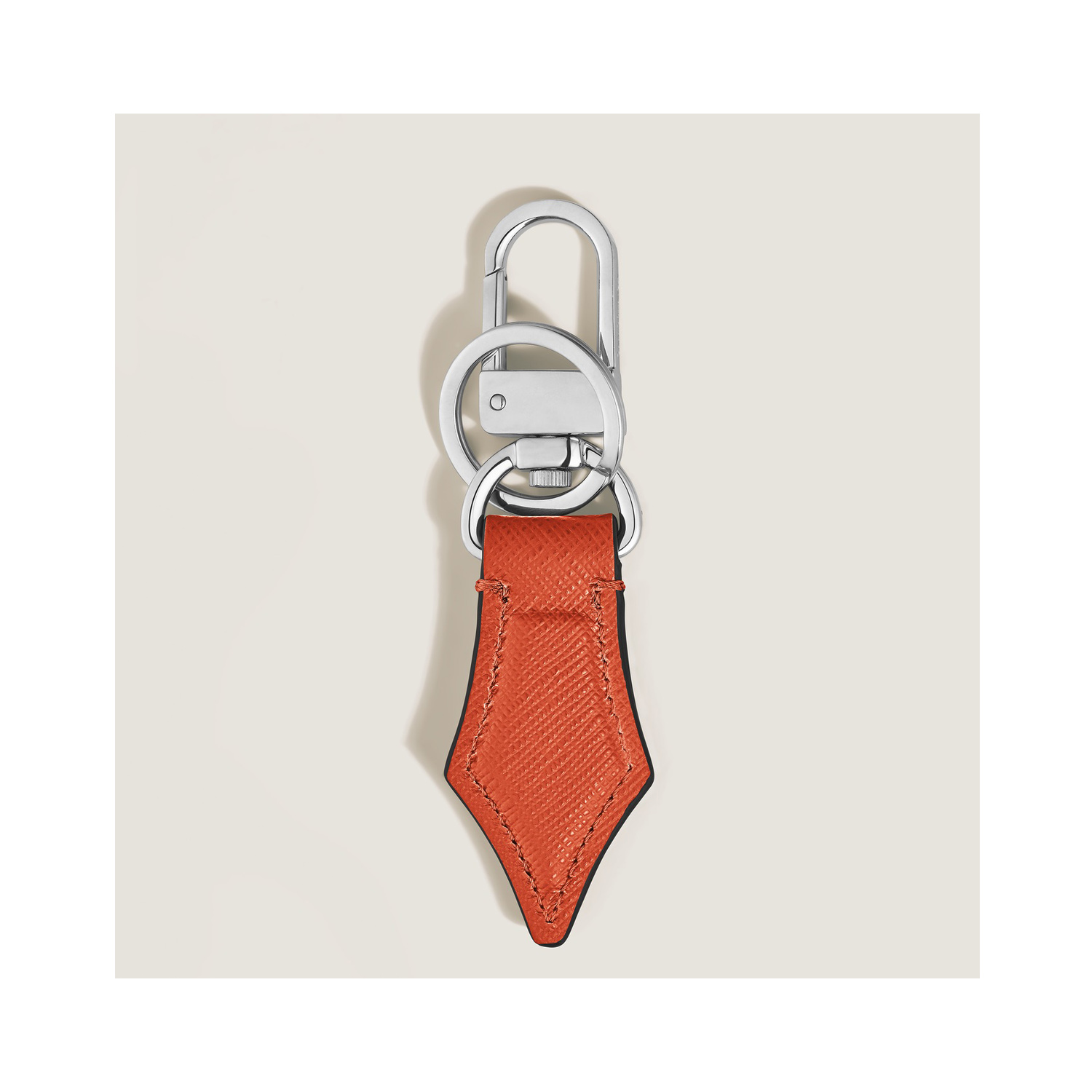 Montblanc, Sartorial Tangerine Nib Key Holder A Montblanc, Sartorial nib key holder in tangerine sartorial leather and shaped to resemble the shape of a pen nib.