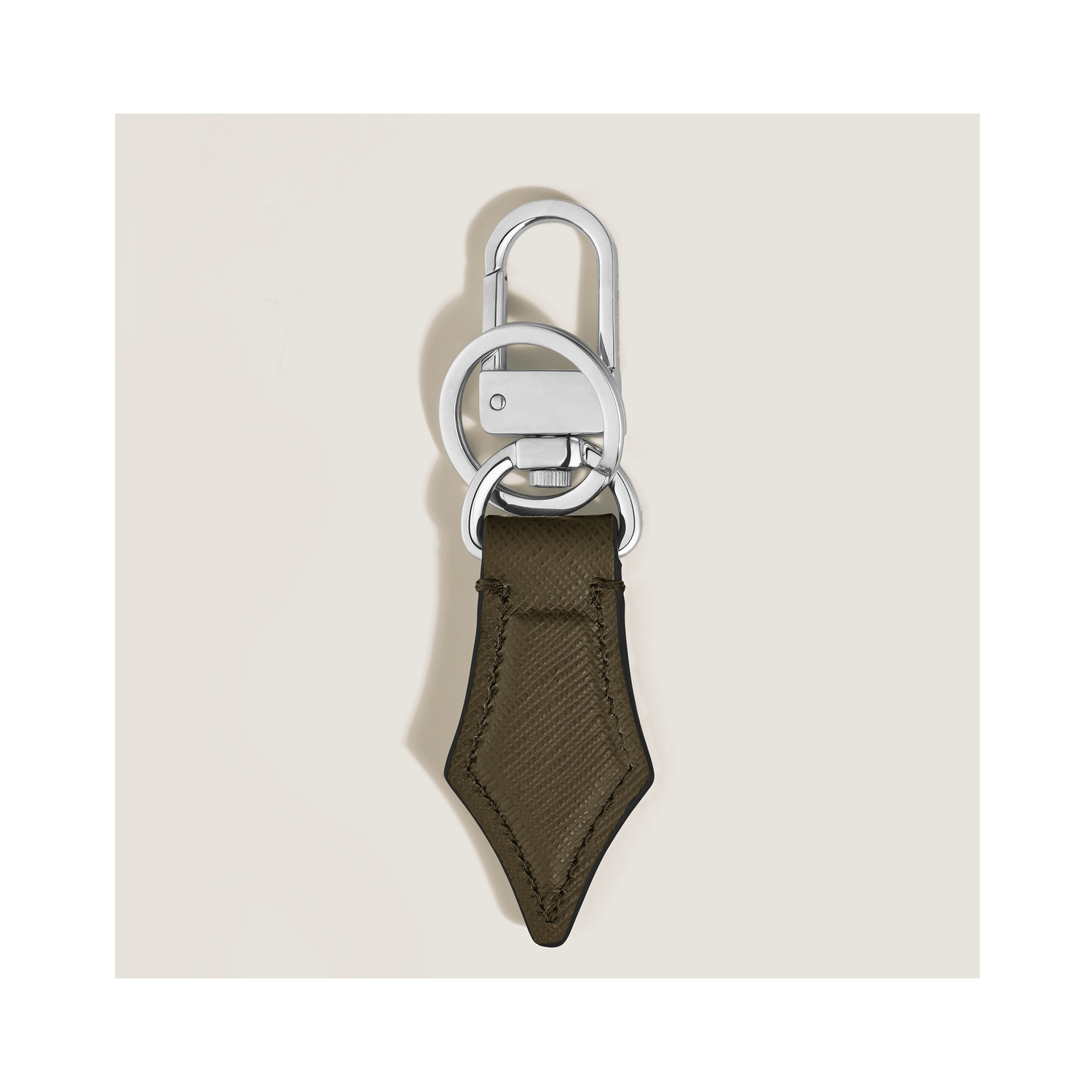 Montblanc, Sartorial Khaki Nib Key Holder A Montblanc, Sartorial nib key holder in khaki sartorial leather and shaped to resemble the shape of a pen nib.