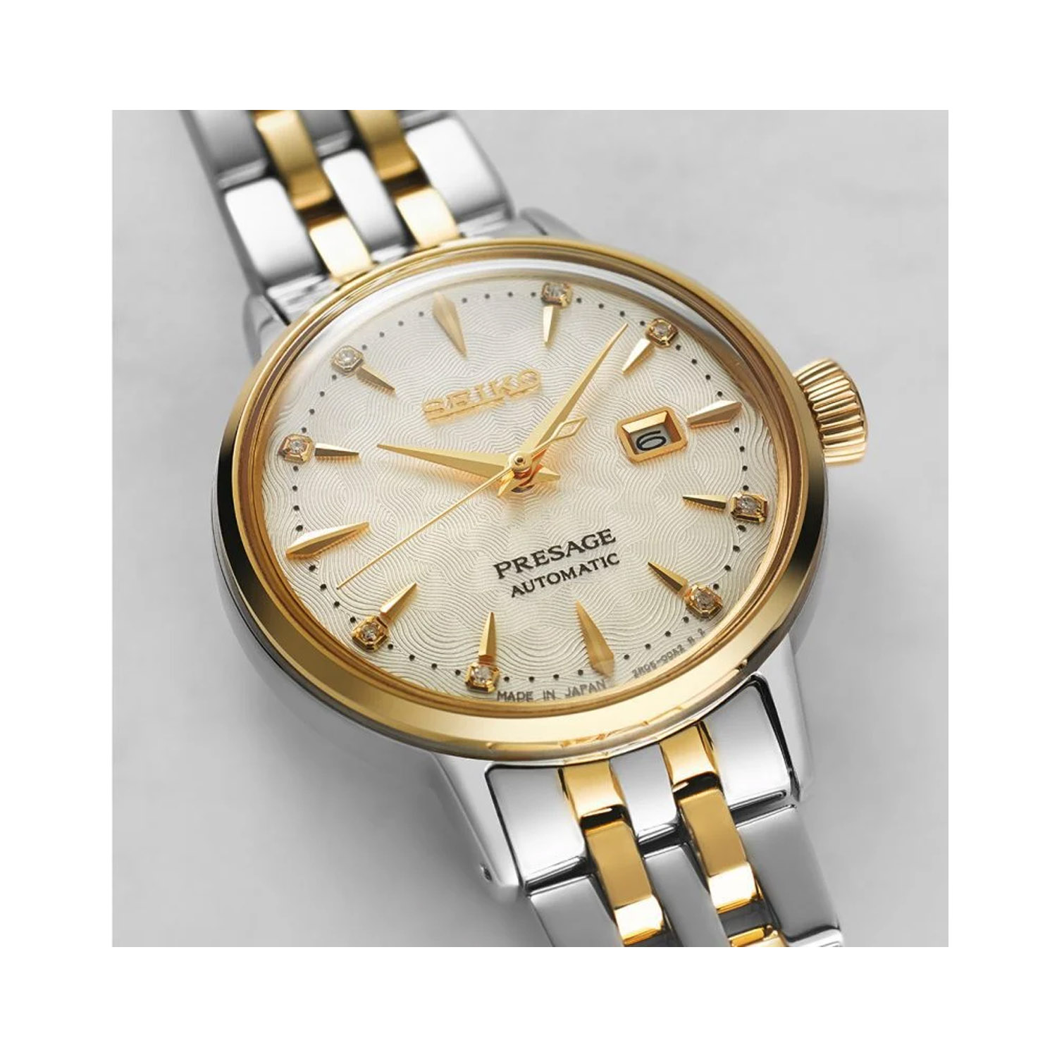 Seiko, Presage Cocktail Time 'White Lady' Diamond Twist with a 30.3mm stainless steel two tone case and bracelet strap featuring a date function and a diamond set white dial.