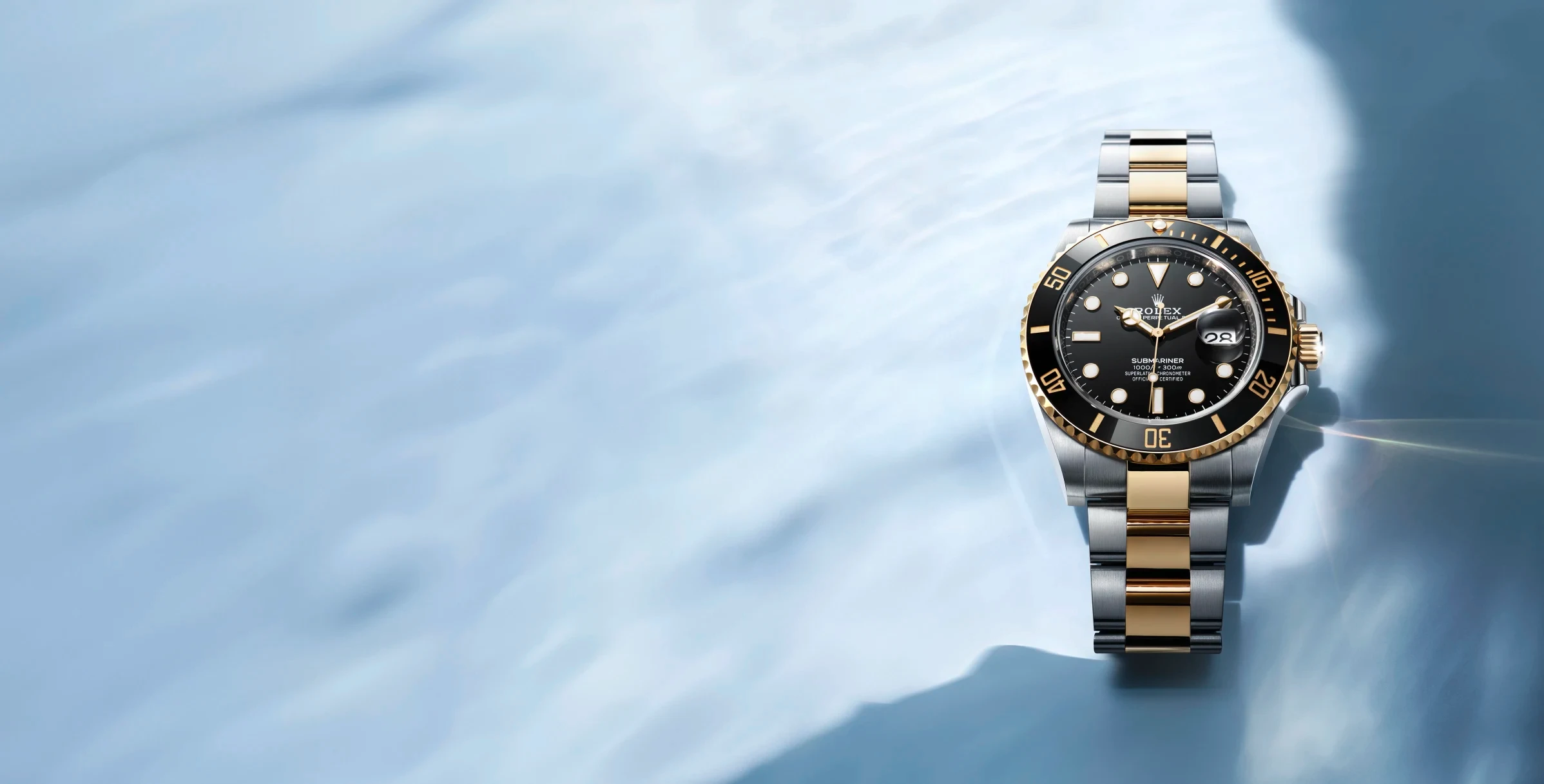Rolex Submariner M126613LN-0002 on blue background