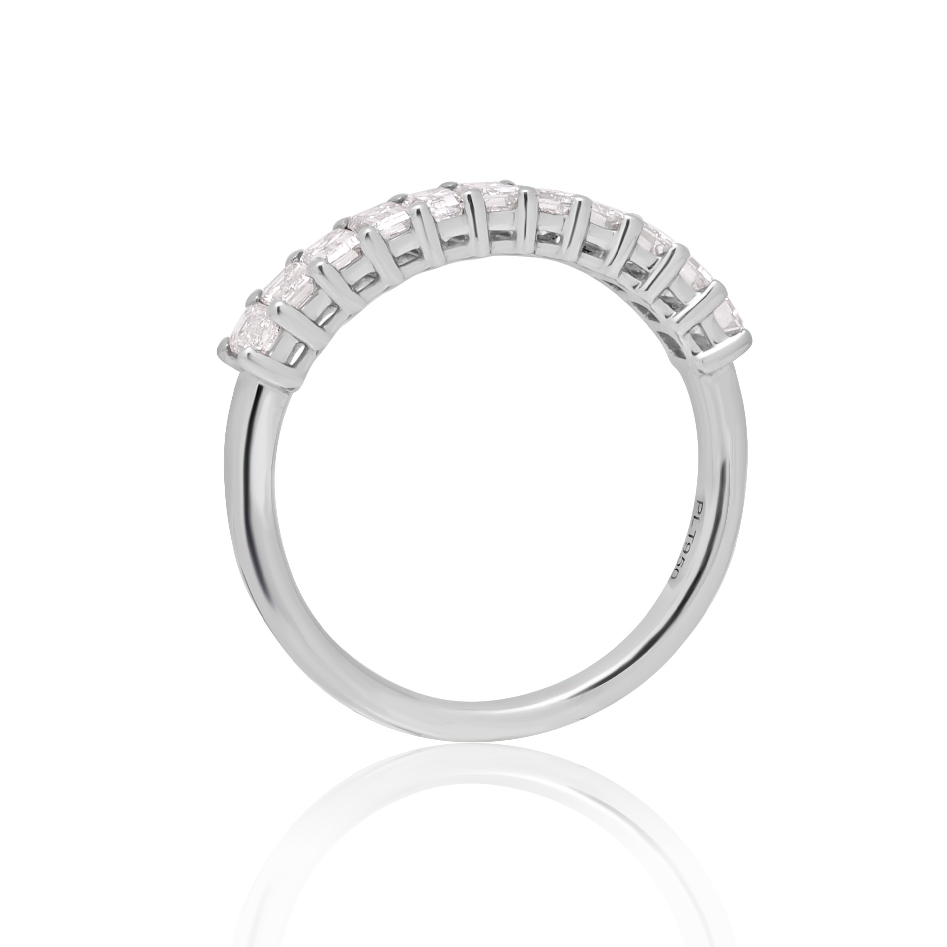 A platinum eleven stone emerald cut claw set diamond half eternity ring.