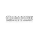 A platinum eleven stone emerald cut claw set diamond half eternity ring.