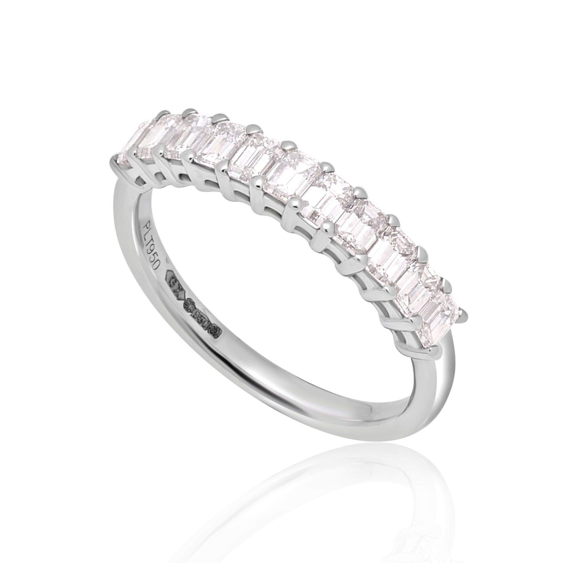 A platinum eleven stone emerald cut claw set diamond half eternity ring.
