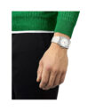 Tissot, PRX with a 40mm stainless steel case and white rubber strap featuring a date function and a white dial.