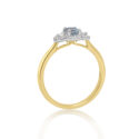 An 18ct yellow gold and platinum oval shaped aquamarine and round brilliant cut diamond set fancy cluster ring.