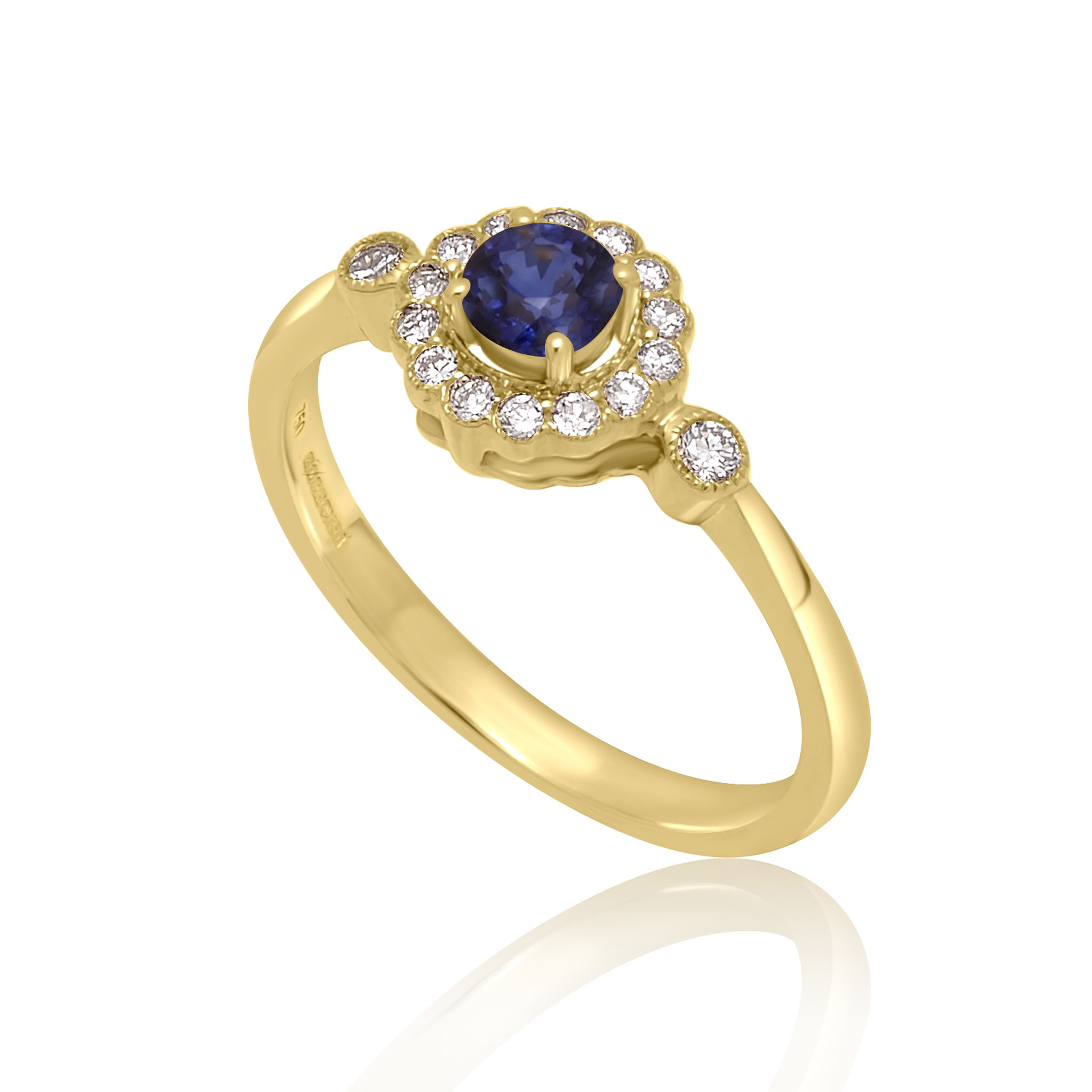 An 18ct yellow gold round sapphire and diamond millgrain set cluster ring with two diamonds set on each shoulder.