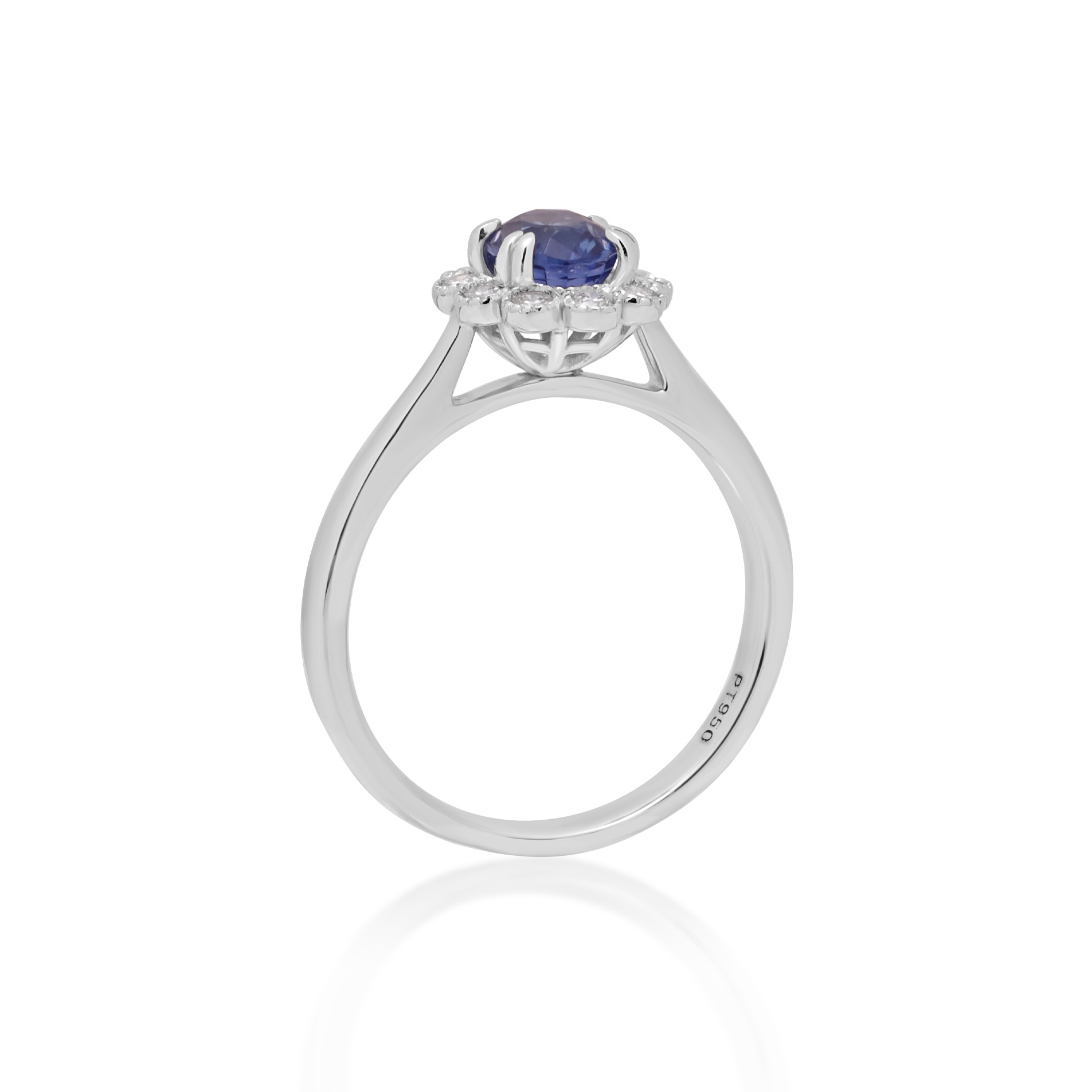 A platinum oval shaped sapphire and round brilliant cut diamond fancy cluster ring.