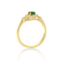 An 18ct yellow gold round emerald and diamond millgrain set cluster ring with two diamonds set on each shoulder.