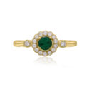 An 18ct yellow gold round emerald and diamond millgrain set cluster ring with two diamonds set on each shoulder.