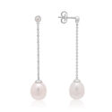 A pair of 9ct white gold freshwater pearl earrings with a single rubover set diamond, with a post and butterfly fastening for pierced ears.