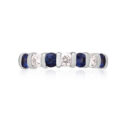 An 18ct yellow and white gold seven stone sapphire and round brilliant cut diamond bar set half eternity ring.