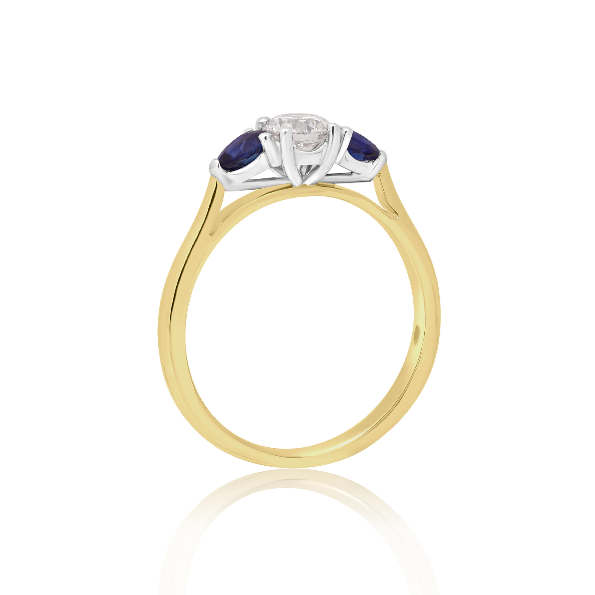 An 18ct yellow and white gold pear shaped sapphire and round brilliant cut diamond three stone ring.