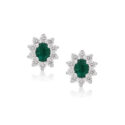 A pair of 18ct white gold oval shaped emerald and round brilliant cut diamond stud earrings, with a post and butterfly clip fastening for pierced ears.