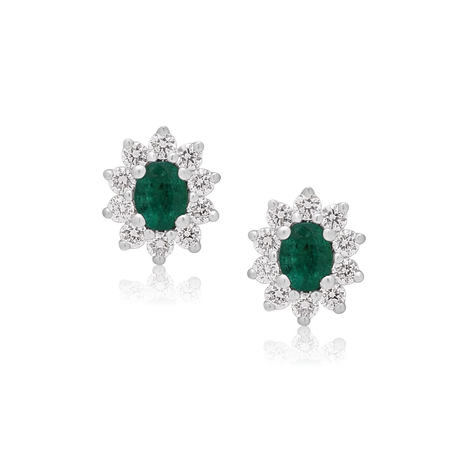 A pair of 18ct white gold oval shaped emerald and round brilliant cut diamond stud earrings, with a post and butterfly clip fastening for pierced ears.
