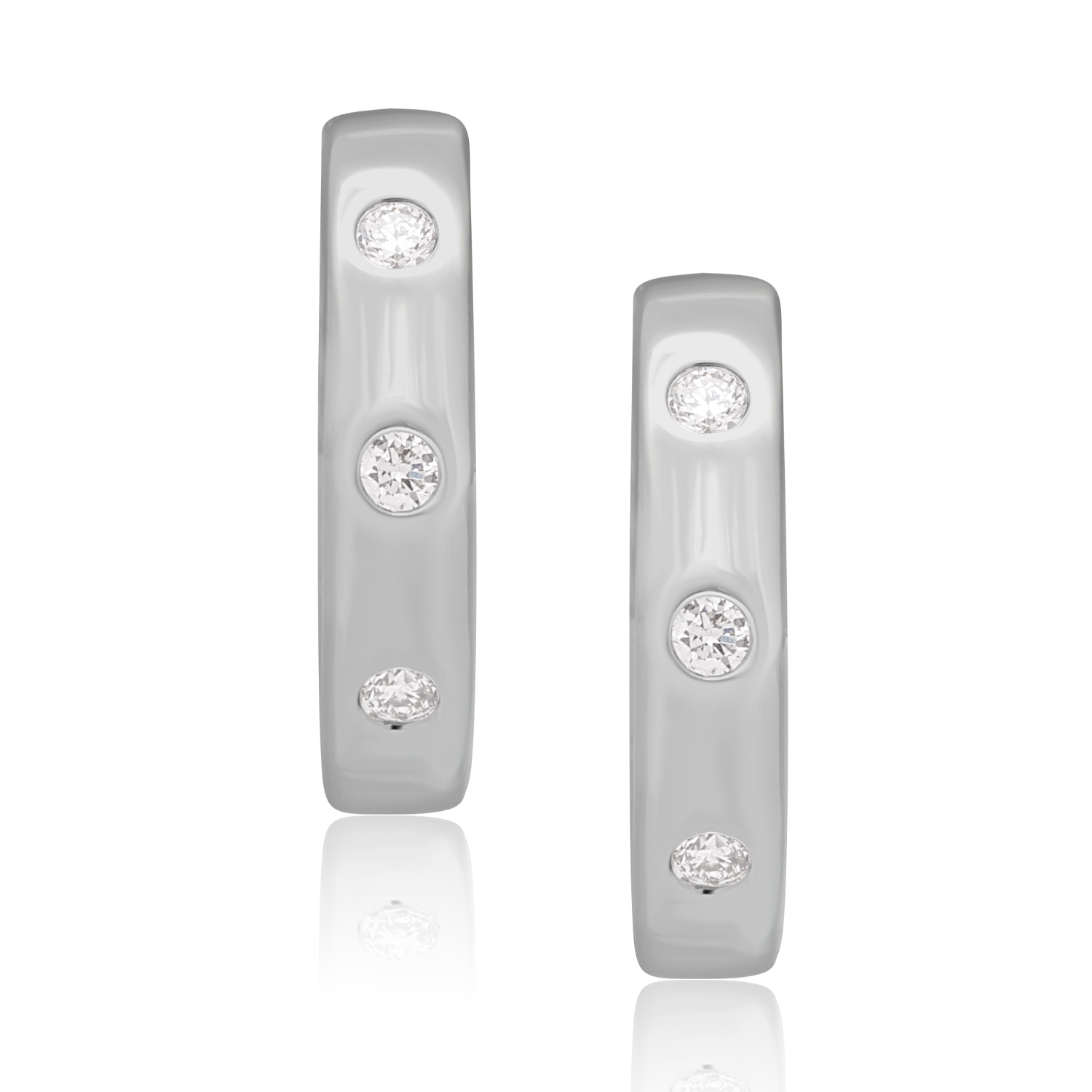 A pair of 18ct white gold diamond set hoop style earrings featuring three round brilliant cut diamonds in each earring, for pierced ears.