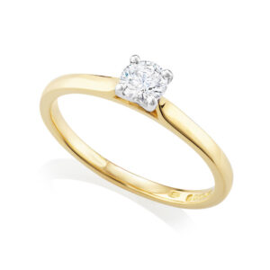 An 18ct yellow gold round brilliant cut, four claw set diamond single stone solitaire ring.