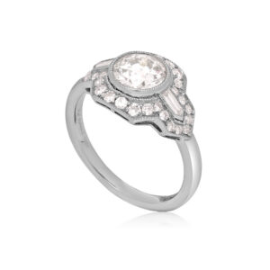 An old European cut diamond, milligraine set, within a mount set with brilliant cut and baguette cut diamonds.