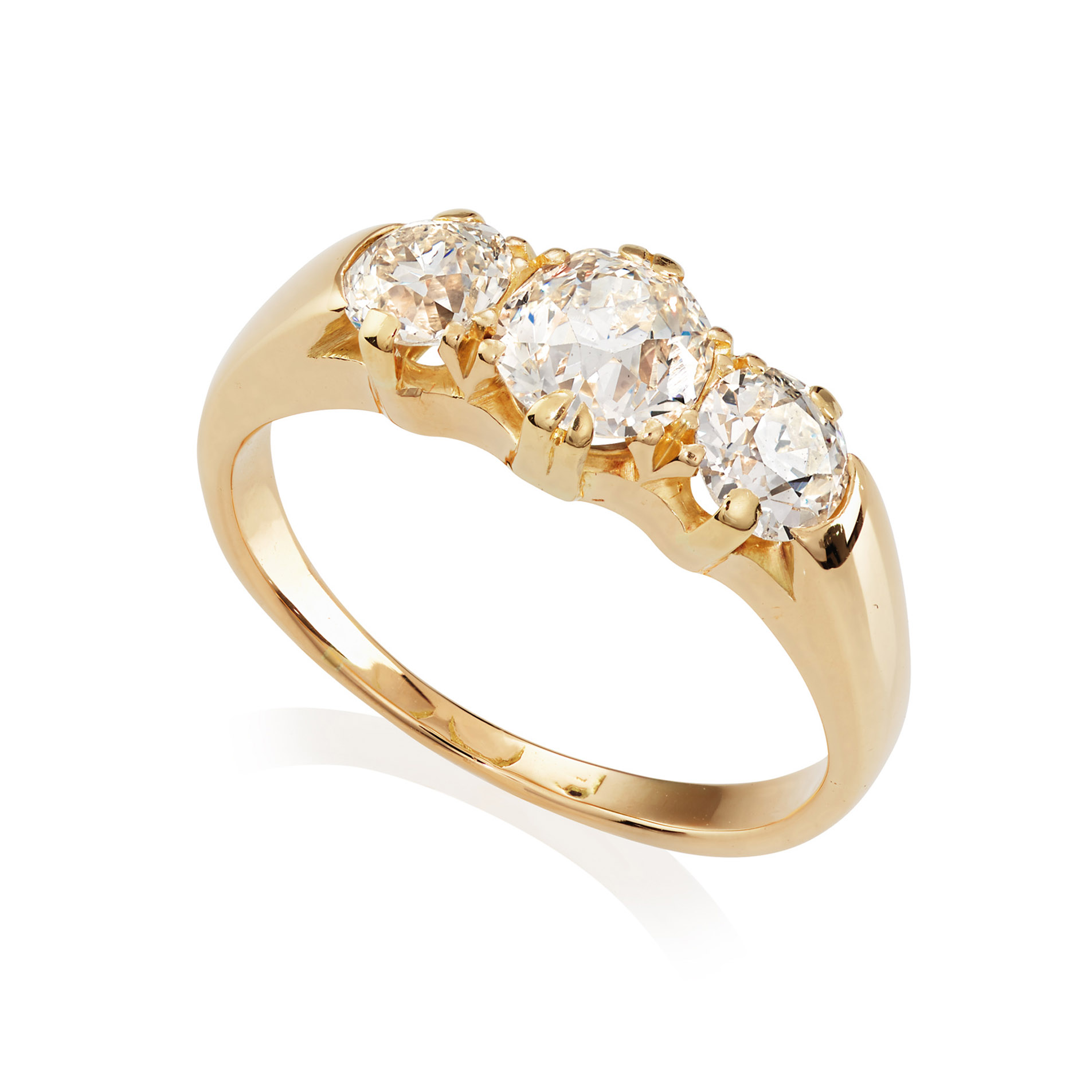 An antique 18ct yellow gold three stone diamond ring, set with old brilliant cut diamonds.