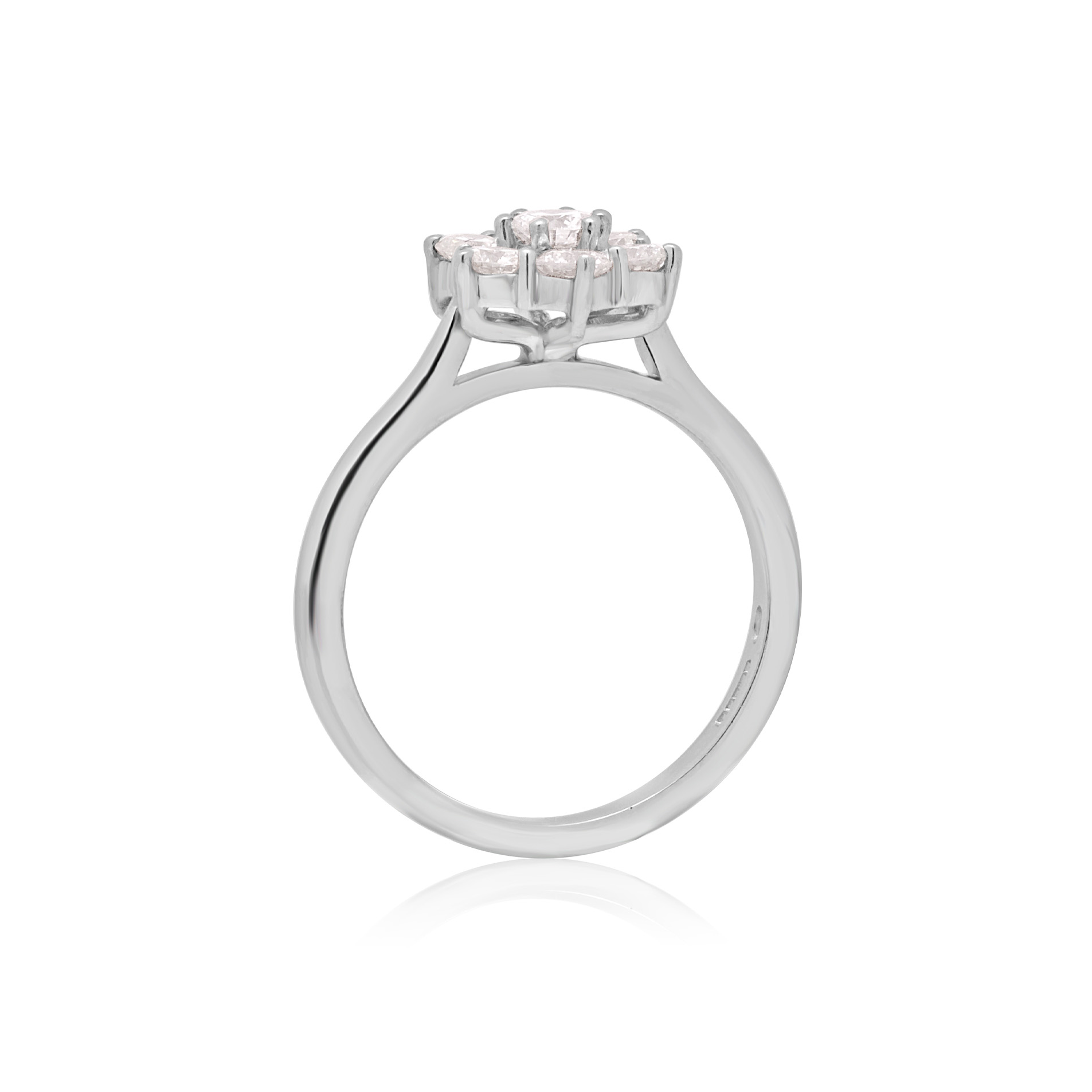 A platinum round brilliant cut diamond seven stone cluster ring with a claw setting.