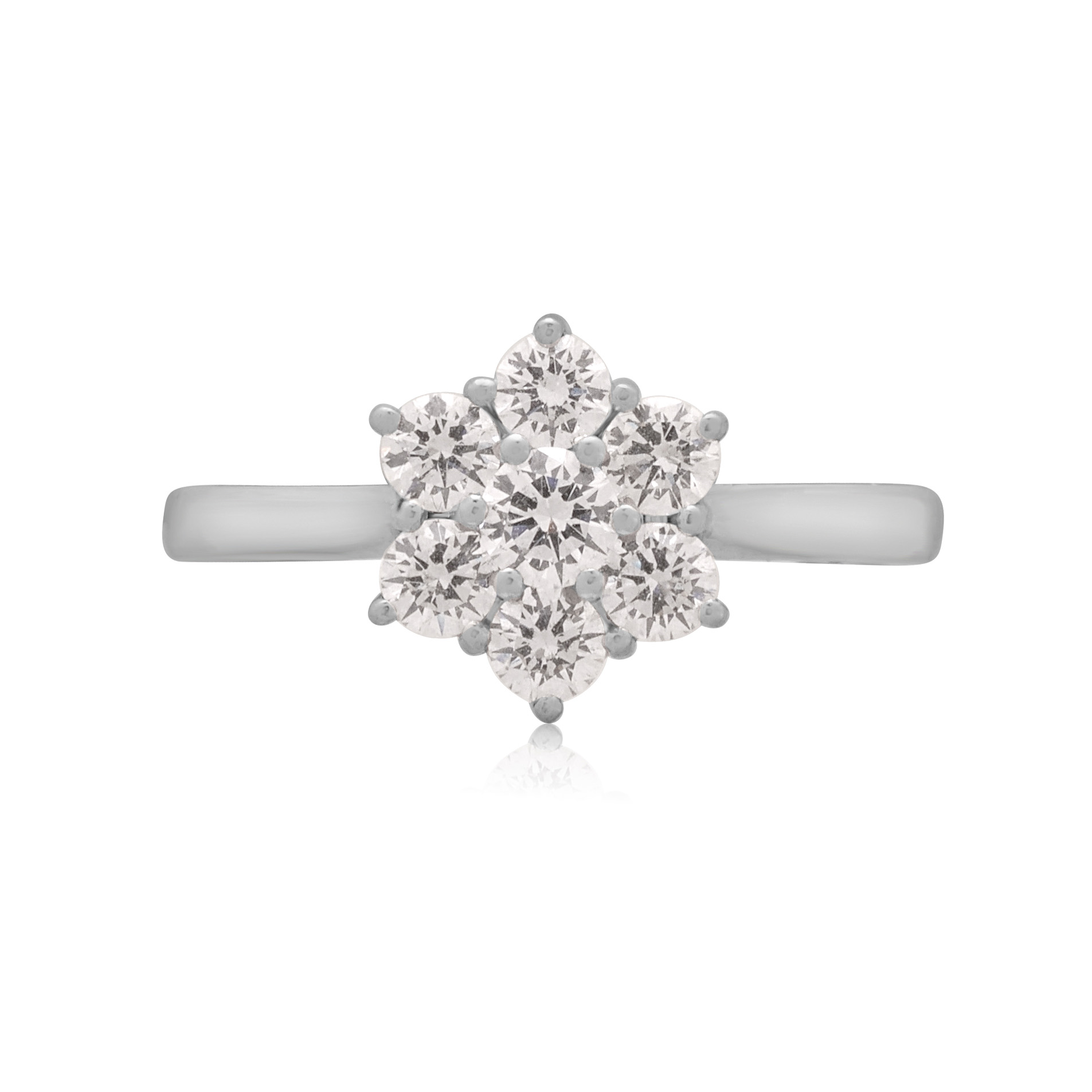 A platinum round brilliant cut diamond seven stone cluster ring with a claw setting.