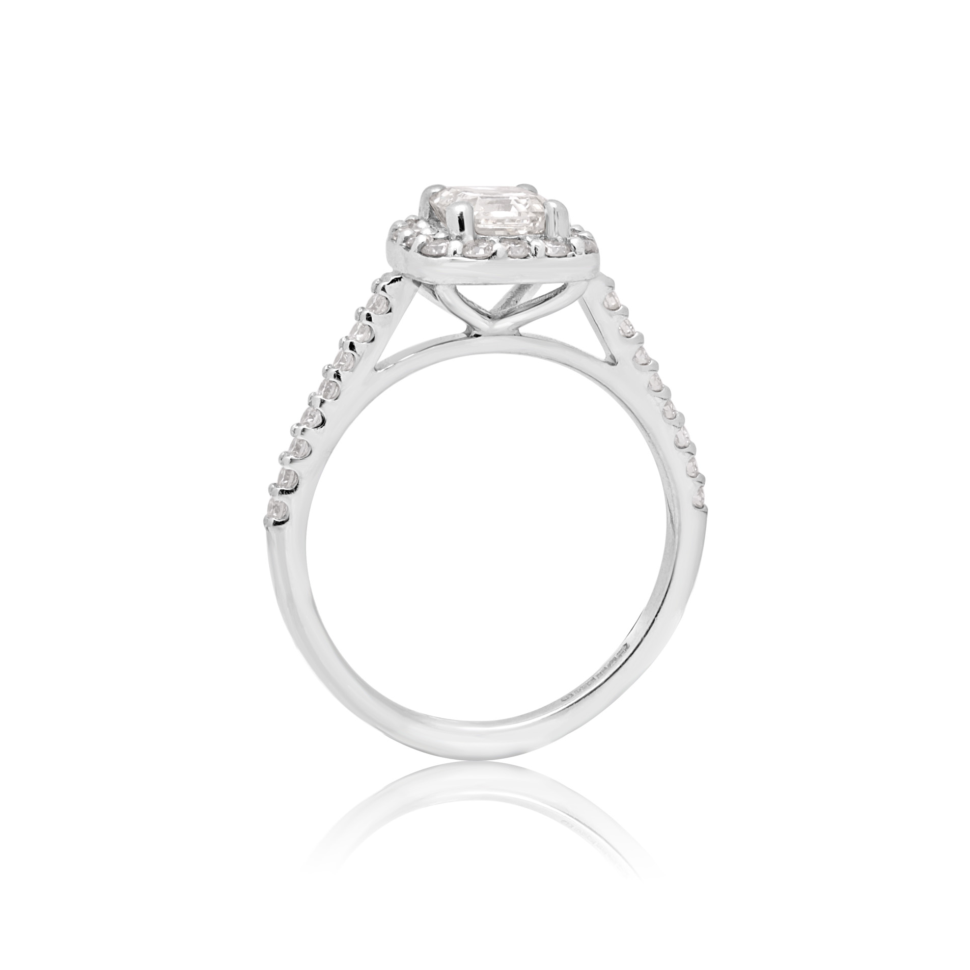Platinum Asscher Cut Diamond Cluster Ring with Diamond Shoulders A platinum Asscher cut diamond cluster ring with diamond set shoulders.