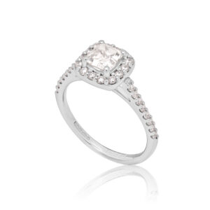 A platinum Asscher cut diamond cluster ring with diamond set shoulders.